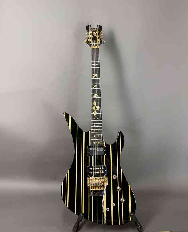 Photo of Schecter Synster Custom-S  Black with Gold Stripes